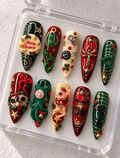 Ten red, green and ivory stiletto Christmas press-on nails with gold stars, holly, bows and sculpted characters.