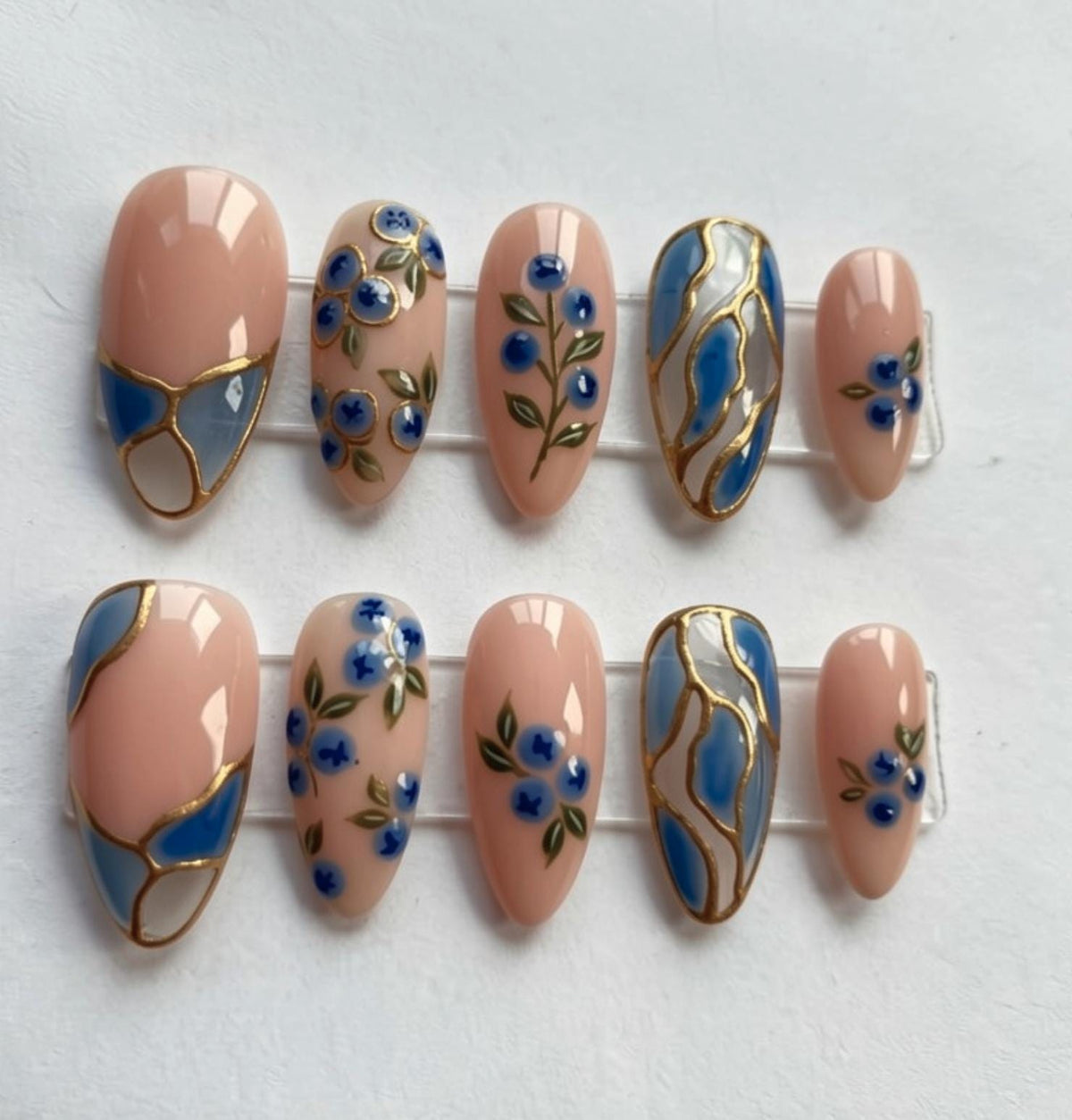 Blue Floral Stained Glass press-on Nails; Elegant Nude Gold Nails.