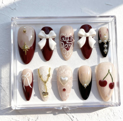 Cherry Valentine press-on Nails; Romantic Bow and Pearl Nails.