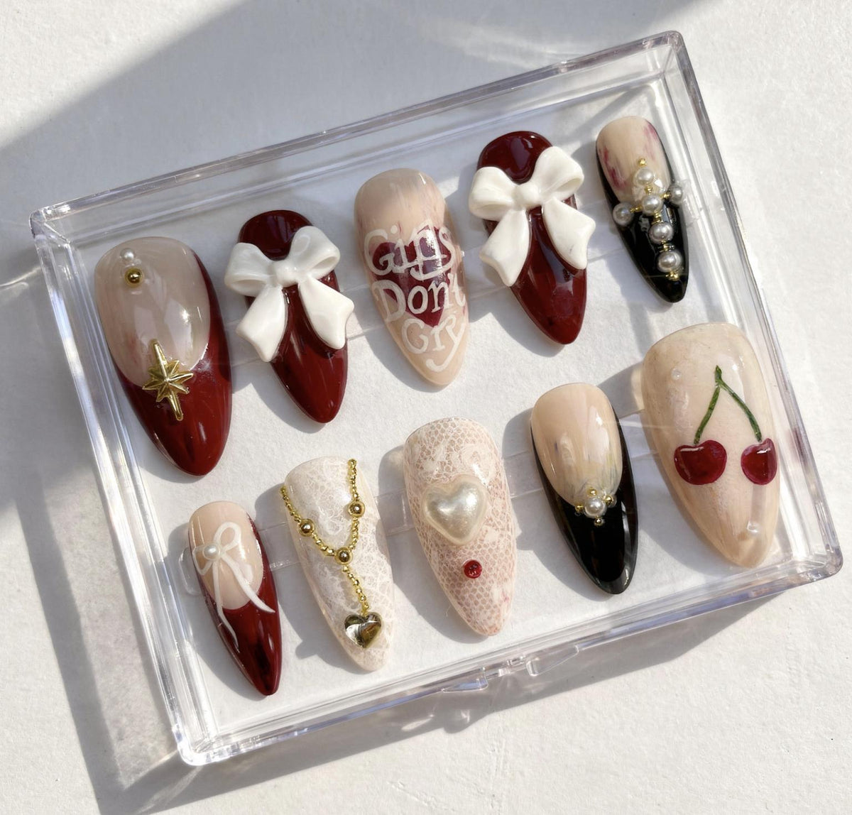 Cherry Valentine press-on Nails; Romantic Bow and Pearl Nails.