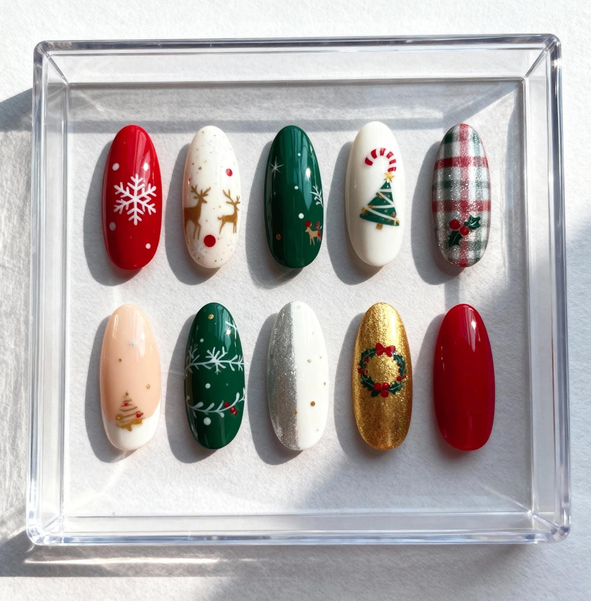 Classic Christmas press-on Nails; Red and Green Holiday Nail Set with Snowflakes, Reindeer and Gold Accents.