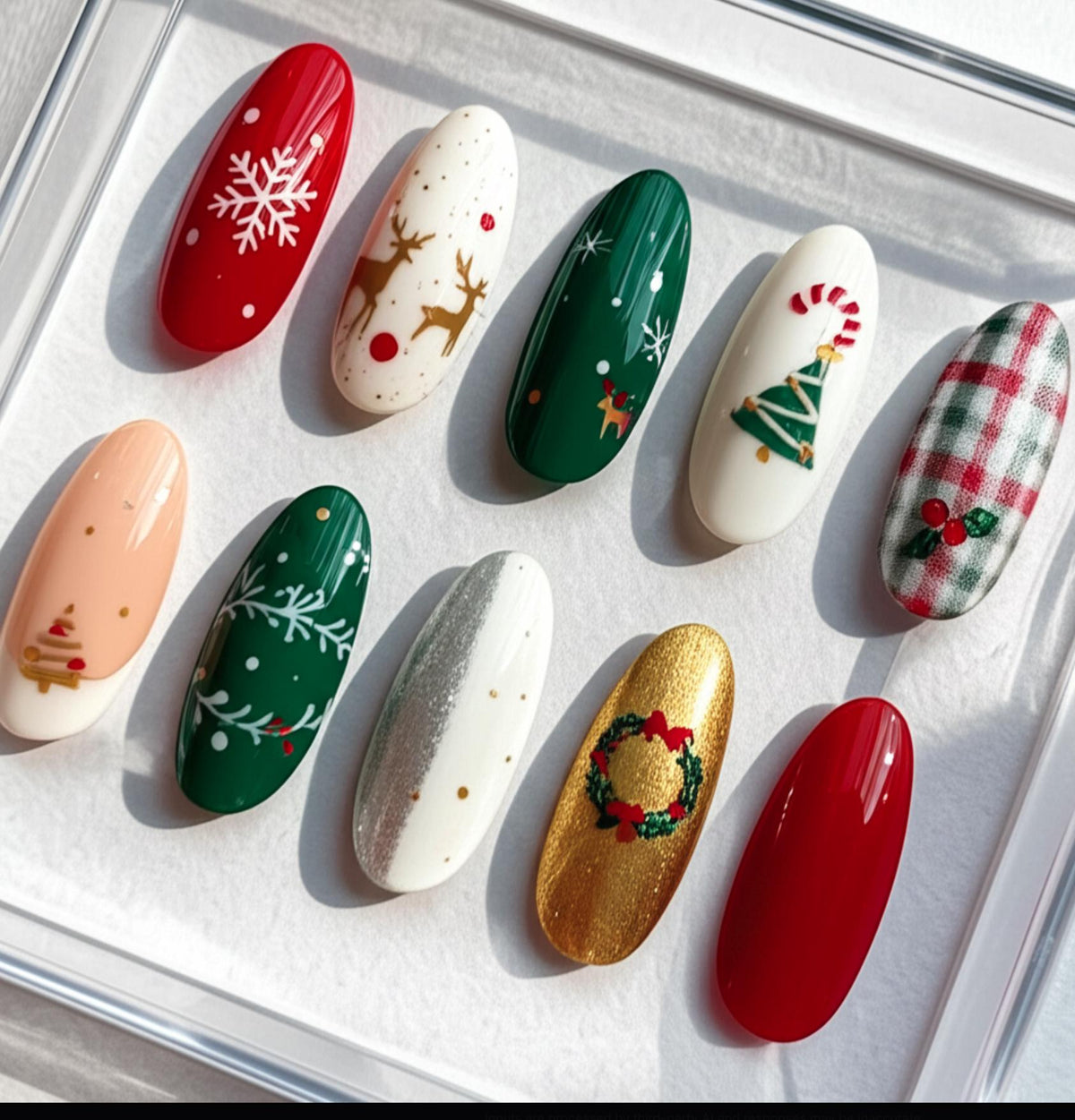 Classic Christmas press-on Nails; Red and Green Holiday Nail Set with Snowflakes, Reindeer and Gold Accents.