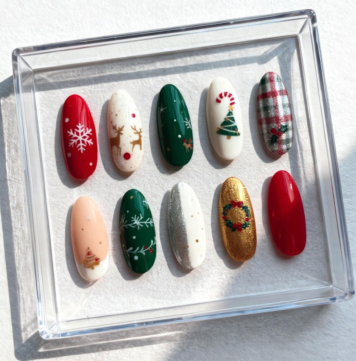 Classic Christmas press-on Nails; Red and Green Holiday Nail Set with Snowflakes, Reindeer and Gold Accents.