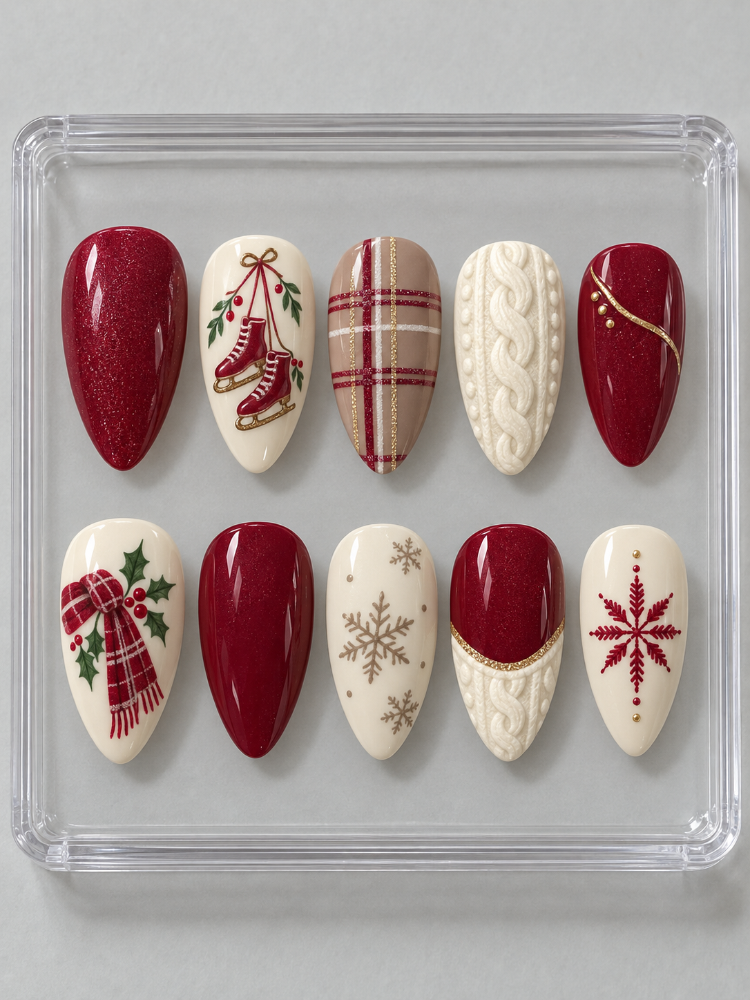 AI design mockup: Ten cranberry, cream and taupe Christmas press-on nails with red ice skates, scarf, plaid, cable-knit textures and snowflakes.