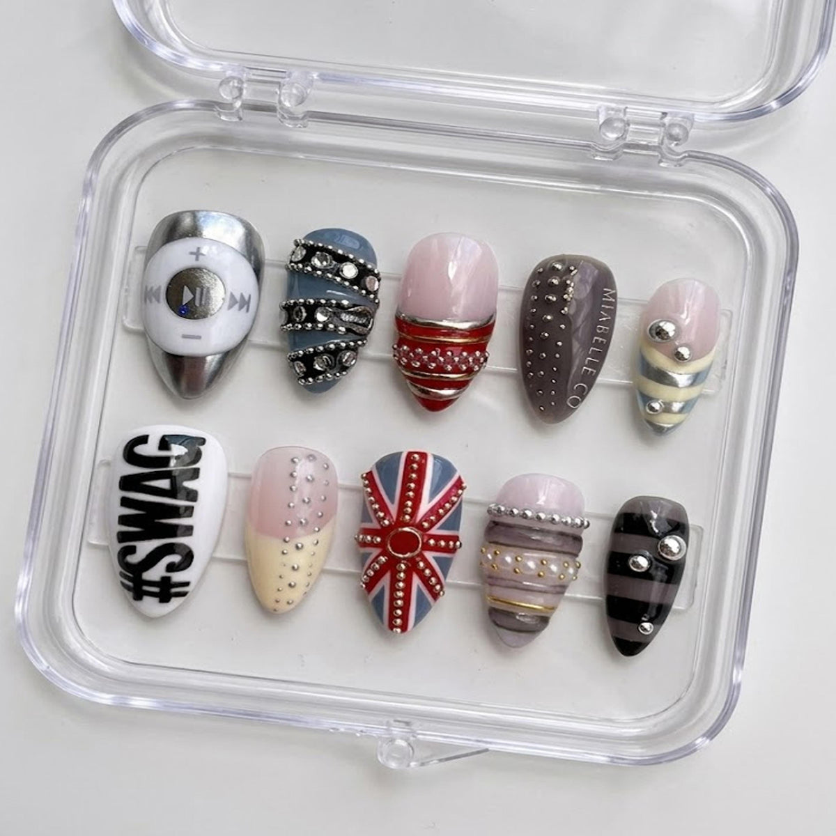 Edgy Mixed Design press-on Nails, Chrome Studded Nails, Punk Glam Nails, Union Jack Inspired Nails, Statement Almond Nails.