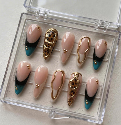 Gold Chrome Leopard press-on Nails; Nude French Tip Nails.
