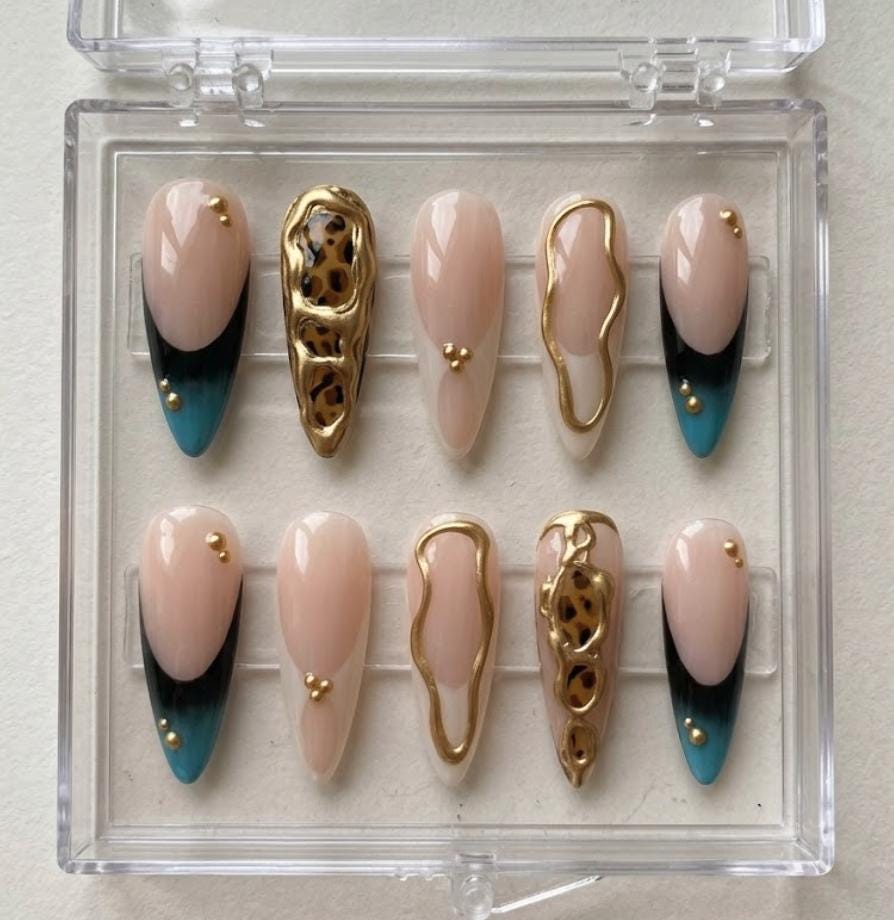 Gold Chrome Leopard press-on Nails; Nude French Tip Nails.