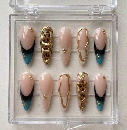Gold Chrome Leopard press-on Nails; Nude French Tip Nails.