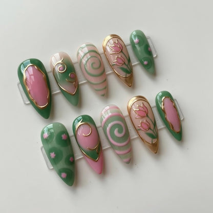 Green Pink Floral press-on Nails; Stained Glass Swirl Nails.