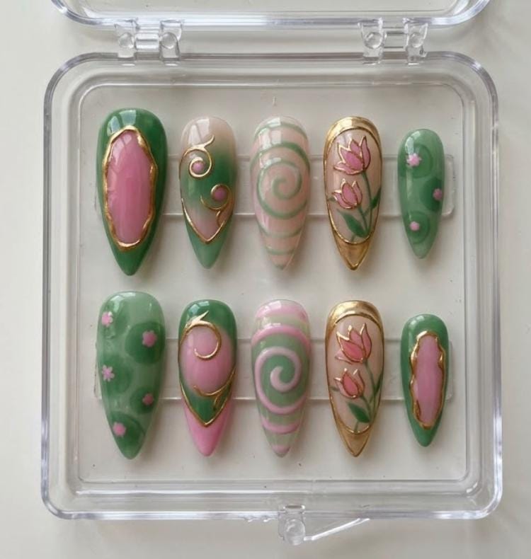 Green Pink Floral press-on Nails; Stained Glass Swirl Nails.