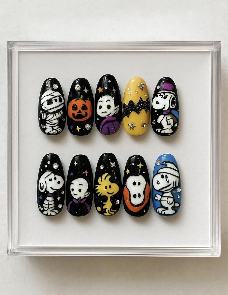 Halloween press-on Nails; Cute Peanuts Cartoon Nails with Ghost, Pumpkin, Mummy and Woodstock.