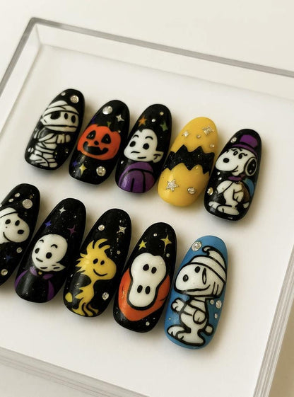 Halloween press-on Nails; Cute Peanuts Cartoon Nails with Ghost, Pumpkin, Mummy and Woodstock.