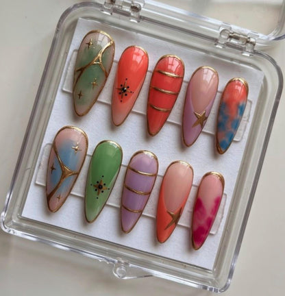 Pastel Stained Glass press-on Nails; Gold Outline Nails.