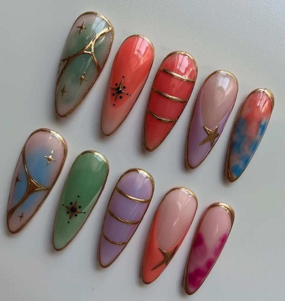 Pastel Stained Glass press-on Nails; Gold Outline Nails.