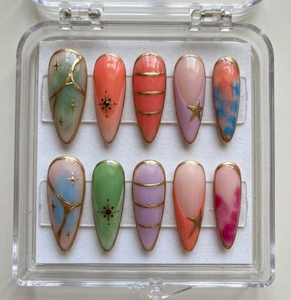 Pastel Stained Glass press-on Nails; Gold Outline Nails.