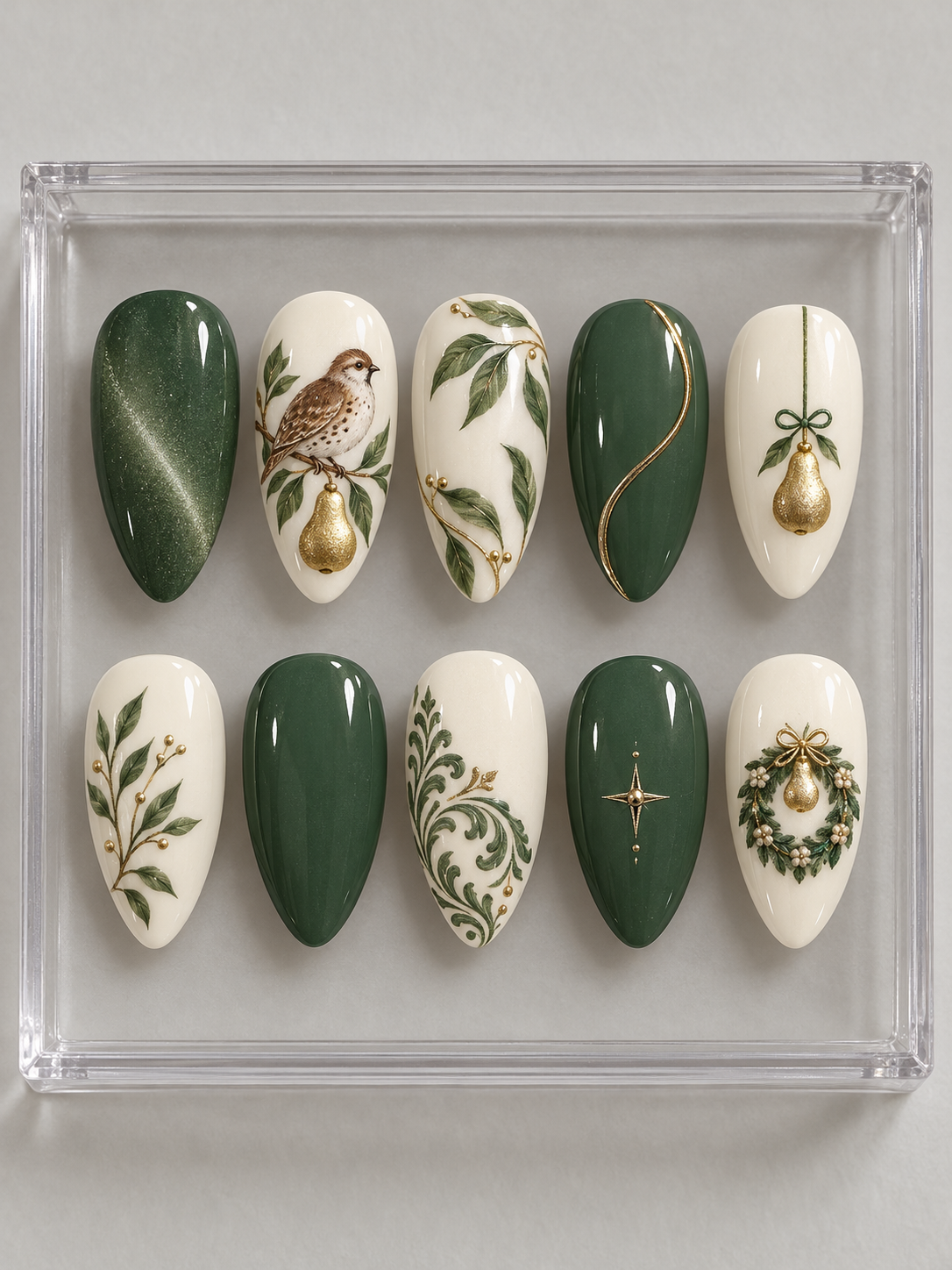 AI design mockup: Ten moss-green and ivory Christmas press-on nails with bird artwork, golden pear ornaments, leafy branches, scrolls and wreath.