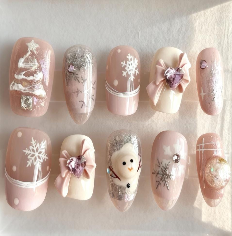 Pink Christmas press-on Nails; Snowflake Winter Nails.