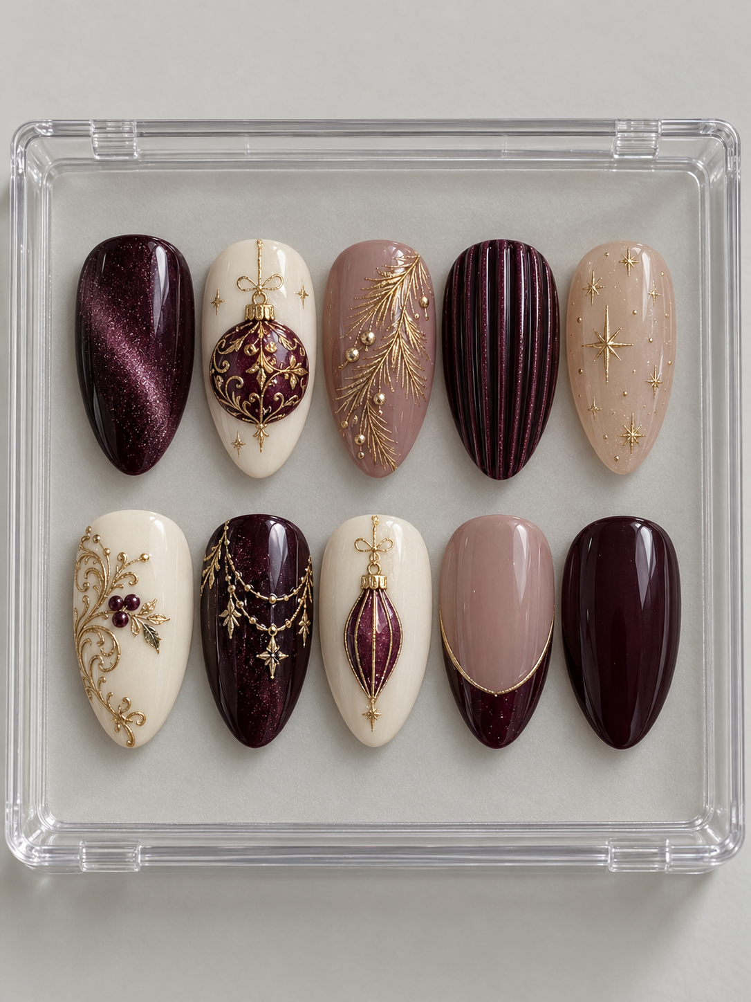 AI design mockup: Ten plum, mauve and ivory Christmas press-on nails with round and elongated baubles, gold-colour filigree, ribbed texture, garlands and French tip.