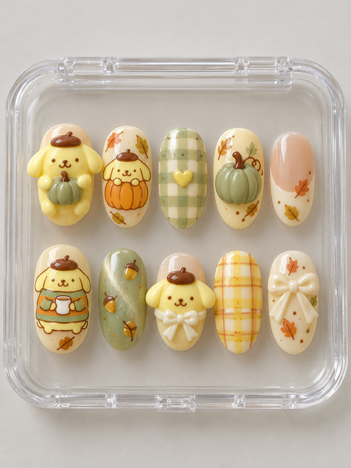 AI design preview: Pompompurin Fall Press-On Nails – Sage Pumpkin Picnic; ten nails combining flat 2D character art and sculpted 3D gel details.