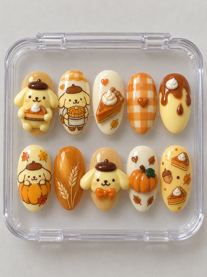 AI design preview: Pompompurin Thanksgiving Press-On Nails – Pumpkin Pie Bakery; ten nails combining flat 2D character art and sculpted 3D gel details.