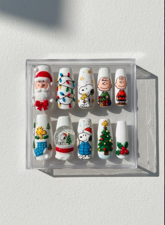 Snoopy Christmas Nails; Handmade 3D Peanuts press-on Nail Set, Cute Holiday Nails with Snoopy, Santa, and Christmas Tree Designs.