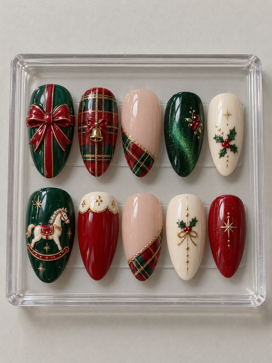 Ten emerald, red, ivory and nude Christmas press-on nails with tartan, gift bow, bell, rocking horse, holly and gold-colour stars.