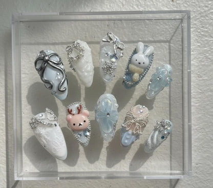 Winter press-on Nails; Ice Blue and Snow White.