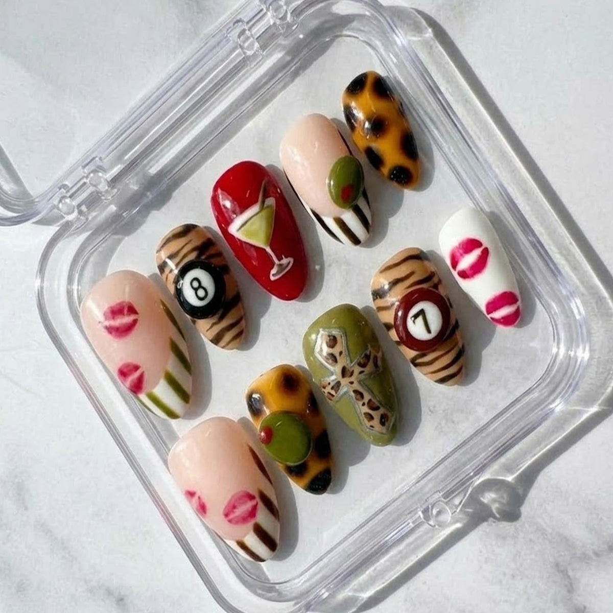 Y2K Glam press-on Nails, Leopard Print Martini Nails, Retro Mixed Design Nails, Lips and 8 Ball Nails, Trendy Almond Nails.