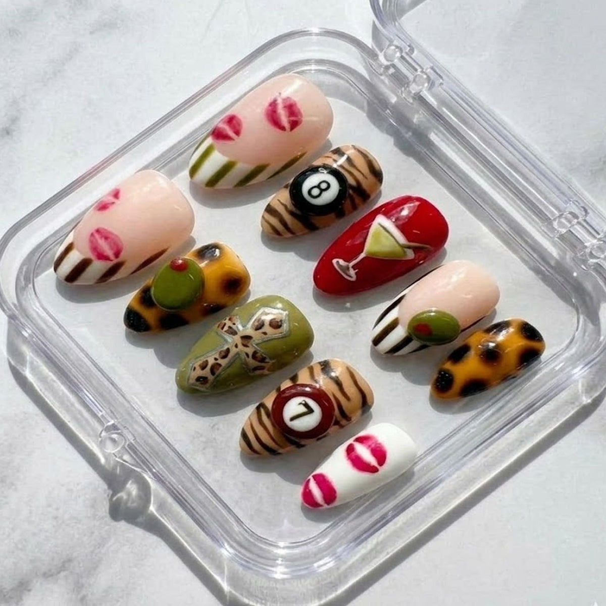 Y2K Glam press-on Nails, Leopard Print Martini Nails, Retro Mixed Design Nails, Lips and 8 Ball Nails, Trendy Almond Nails.